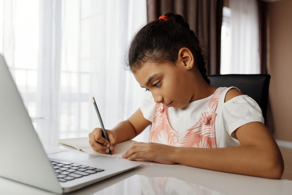 Student following an online course on a laptop