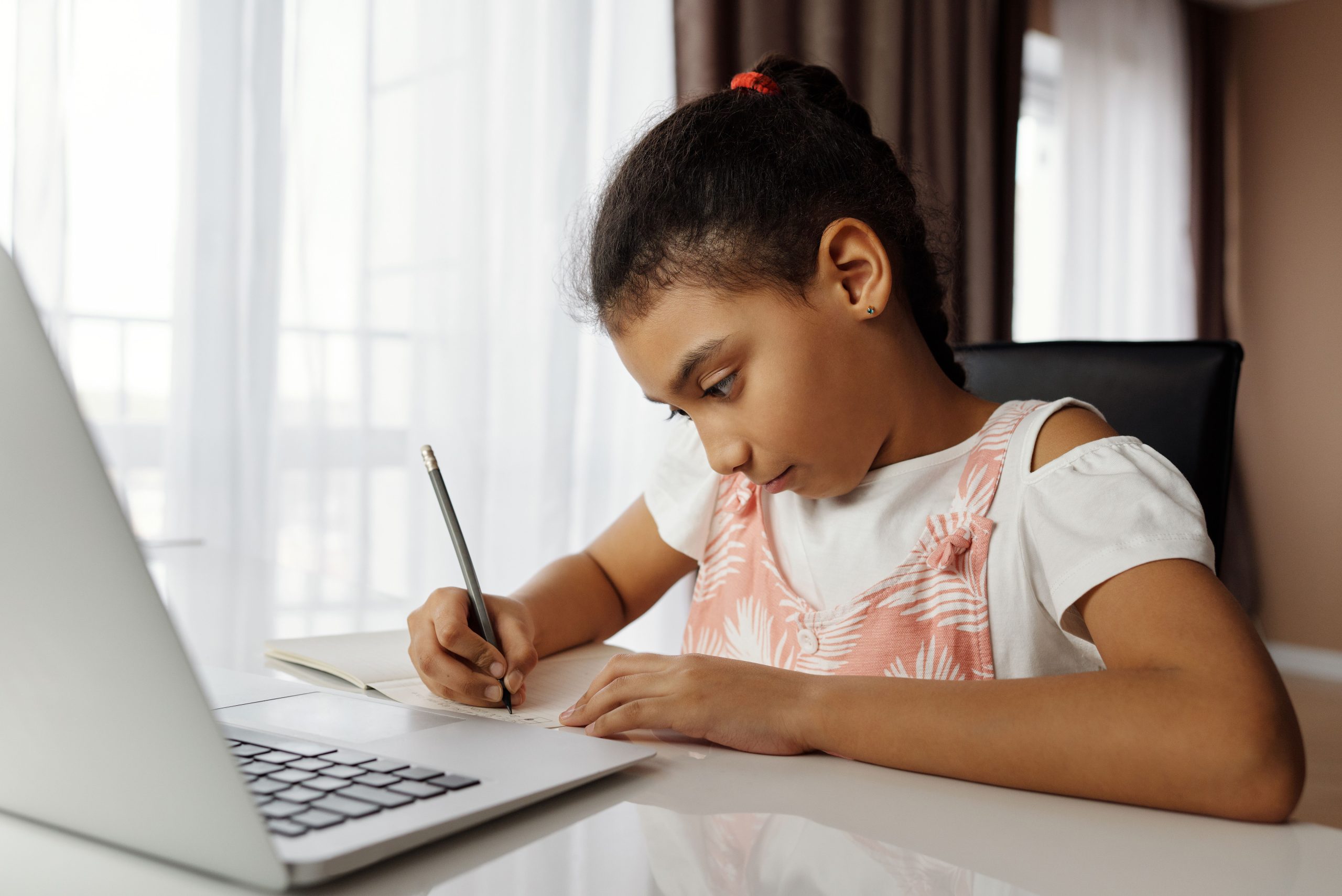 Student following an online course on a laptop